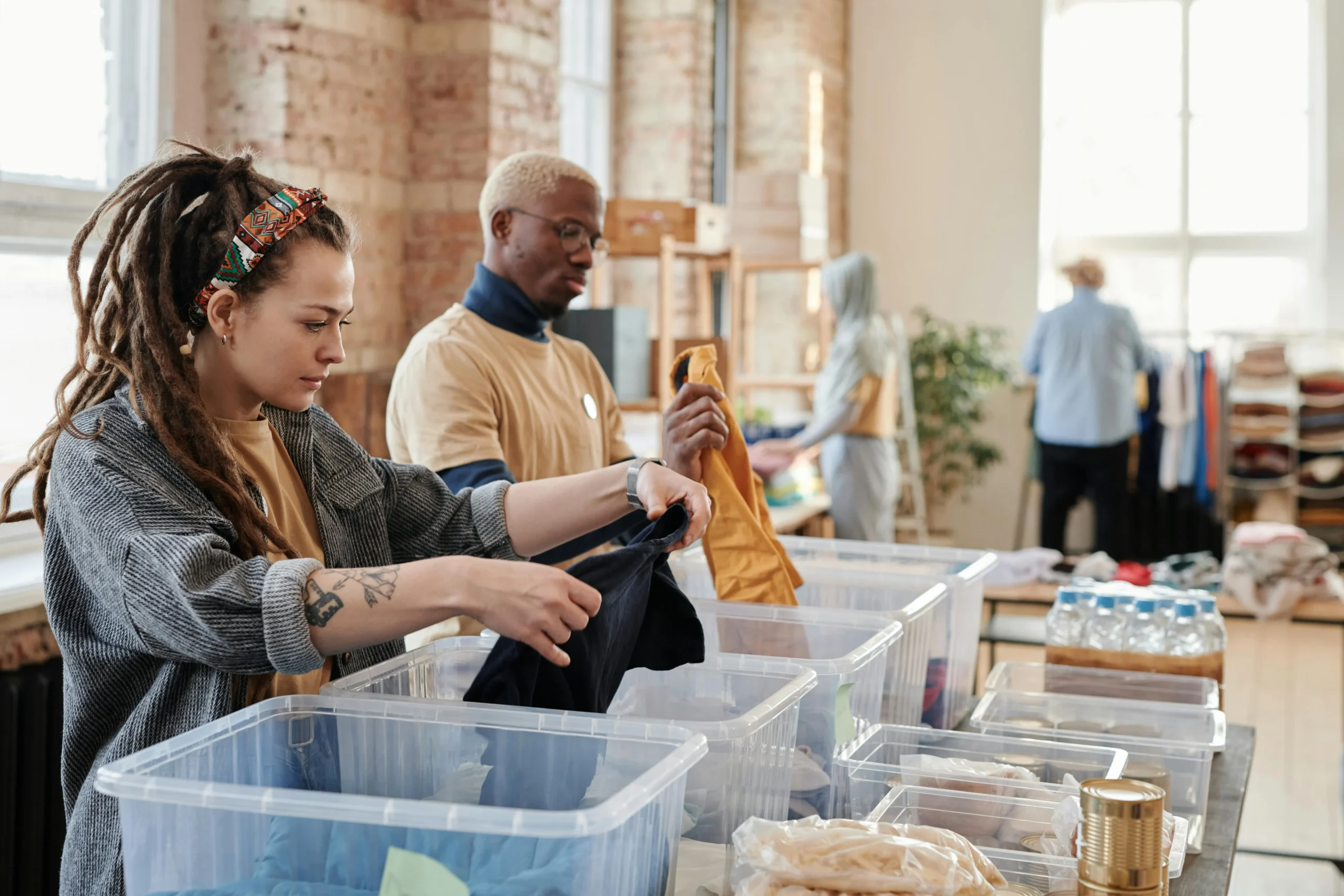 a group of volunteers putting together care packages.