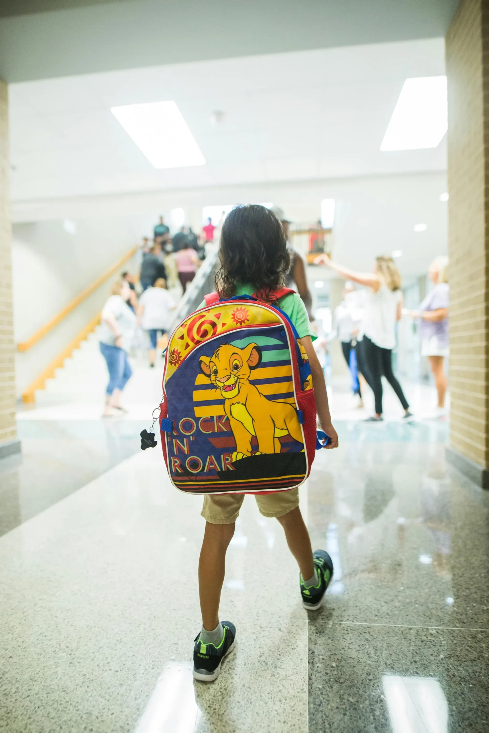 a child wearing a backpack.